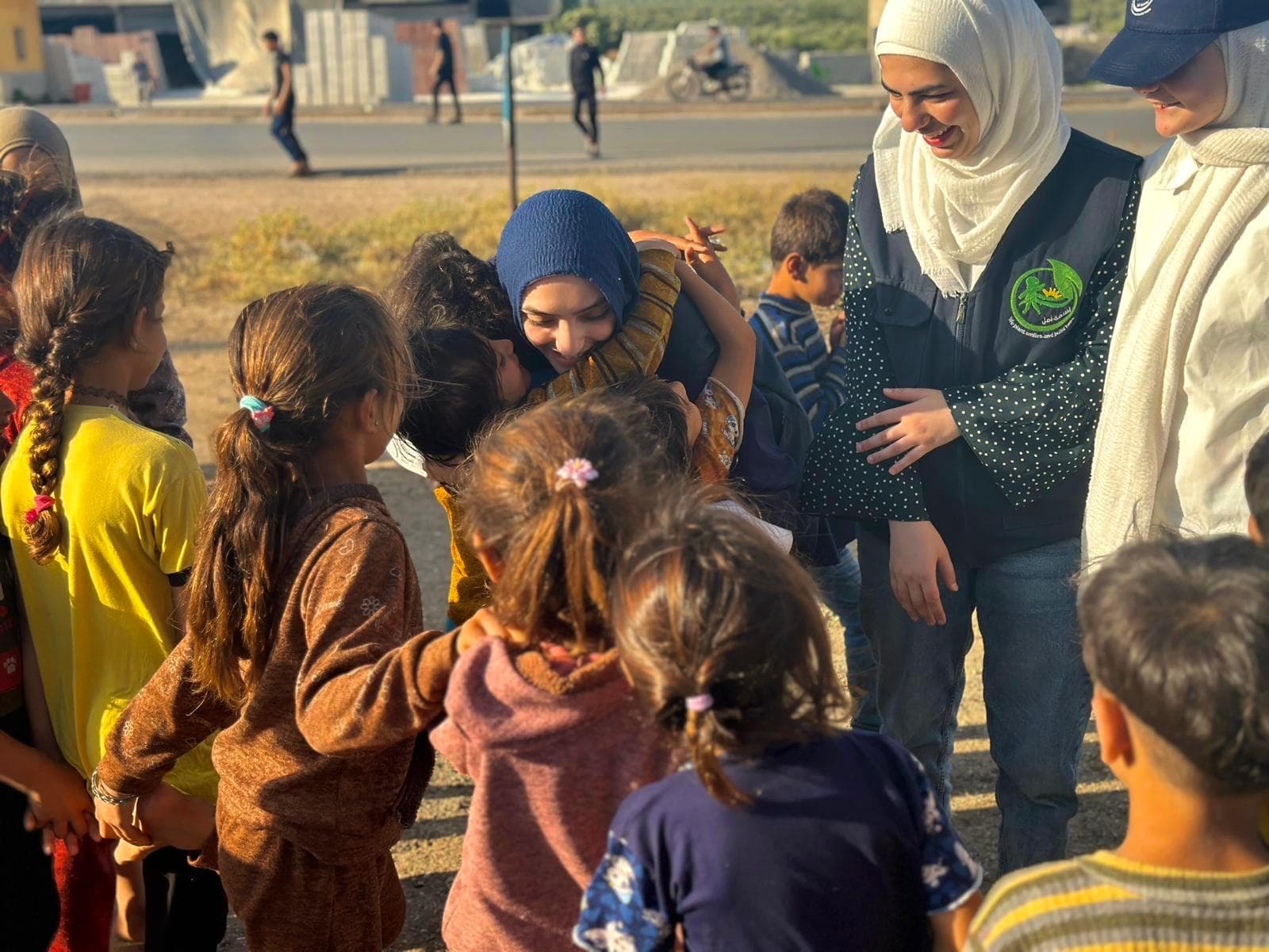 Basmet Amal volunteers with children in Syria